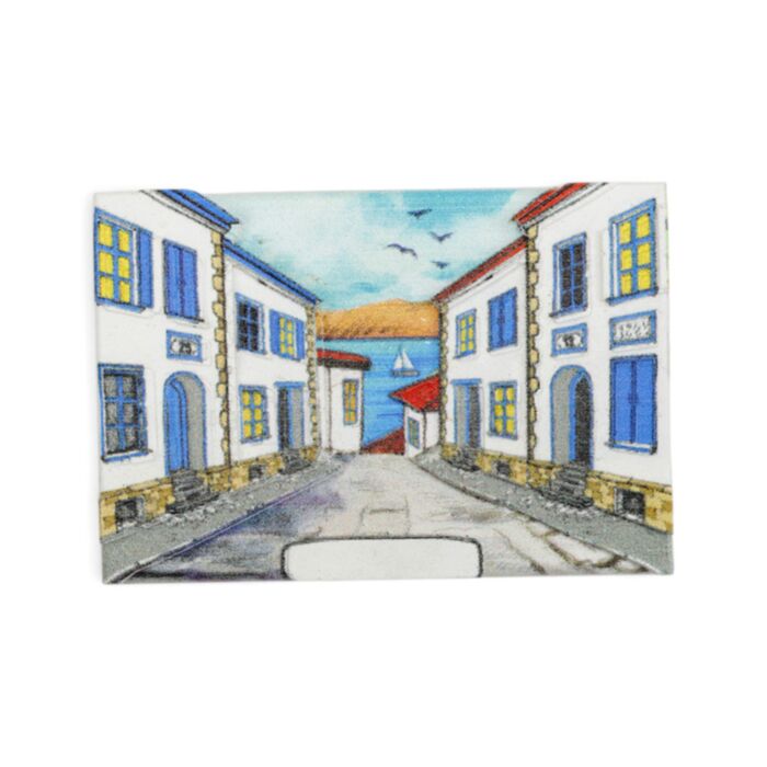 Íman de praia para lembrança Cena de rua com casas pintadas